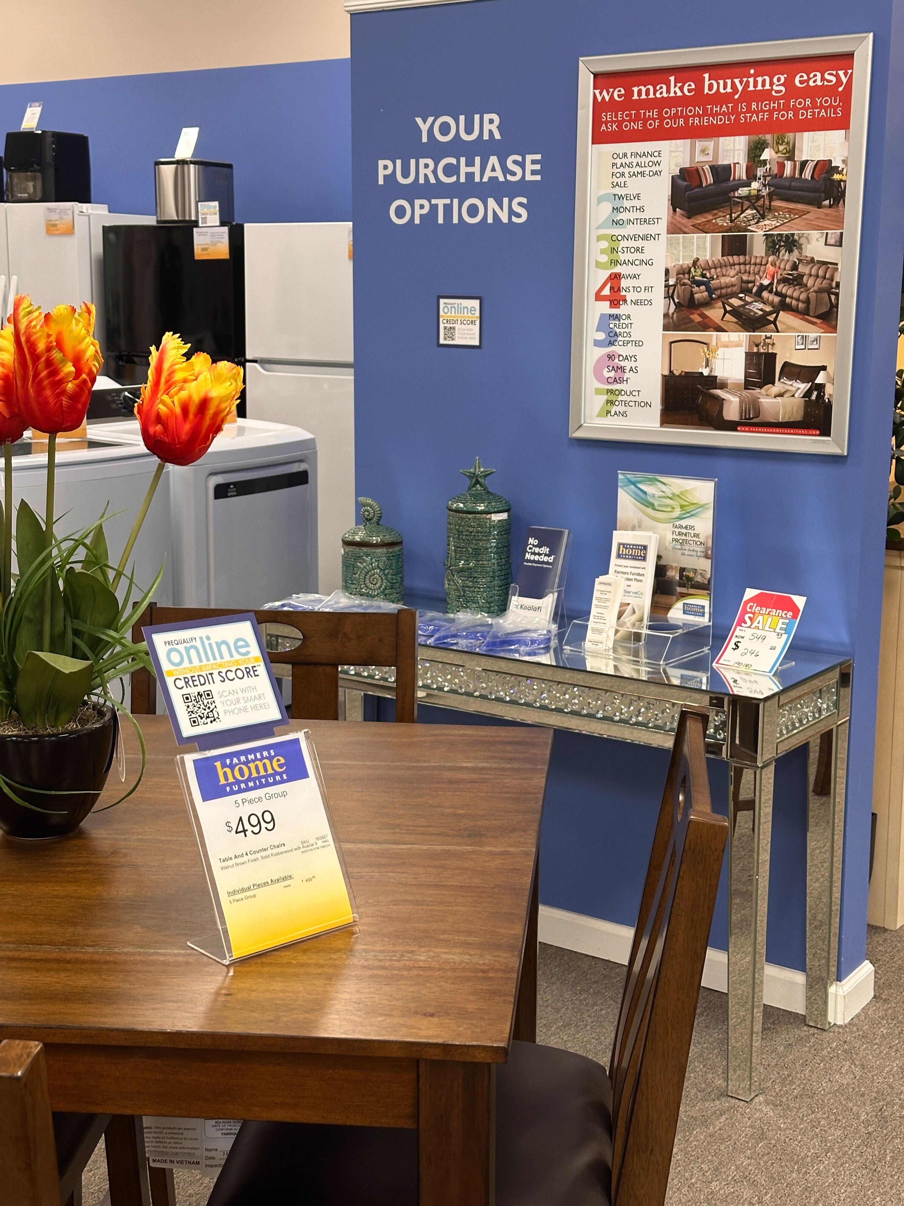 In-store prequalification signage in Lewisburg, TN showing 'Your Purchase Options' with online credit score check.