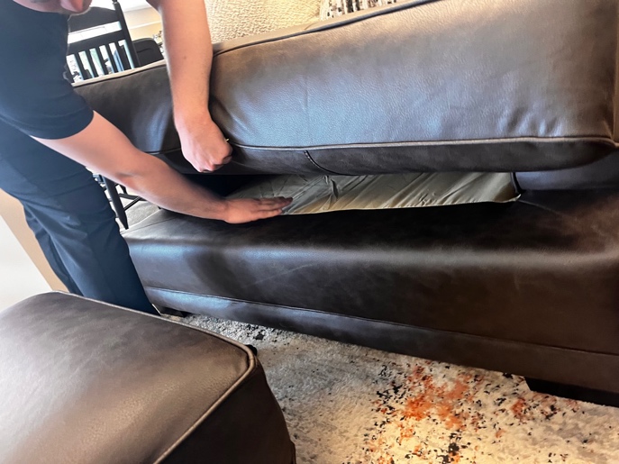 A Farmers Home store associate helping a customer on the showroom floor.