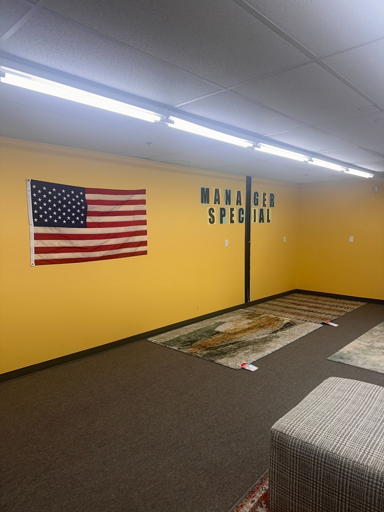 A dim clearance room at the back of a store.